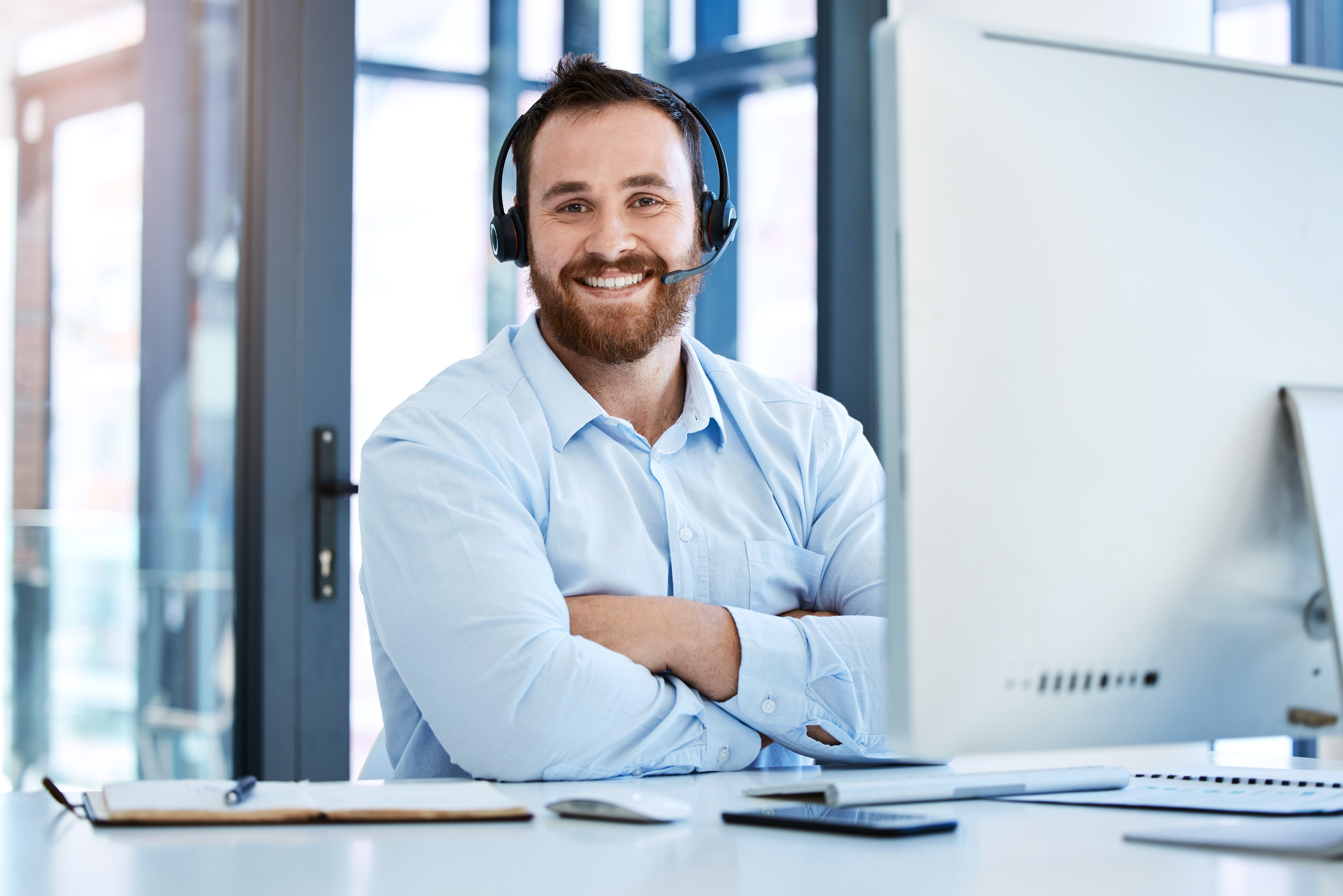 portrait-of-a-young-call-centre-agent-working-on-a-2022-10-11-02-06-30-utc